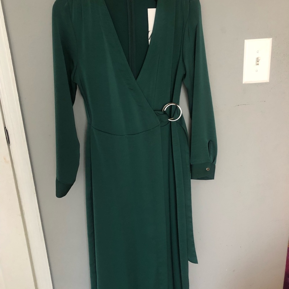 Wrap jump suit, very elegant. Brand new tags still attached